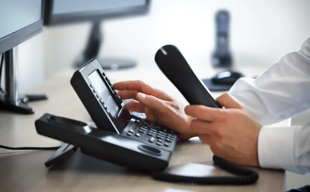 man picking up business phone